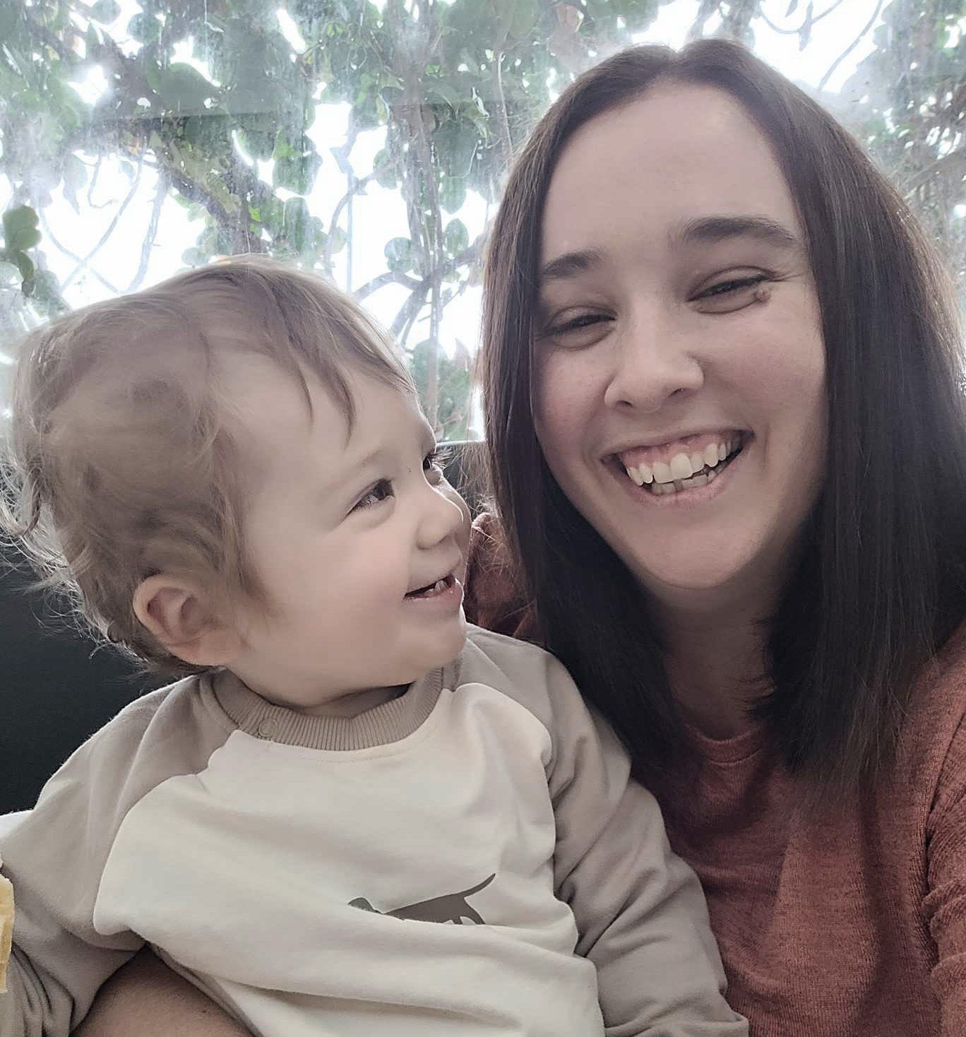 Ashley, founder of My Red Thread Tales, with her son